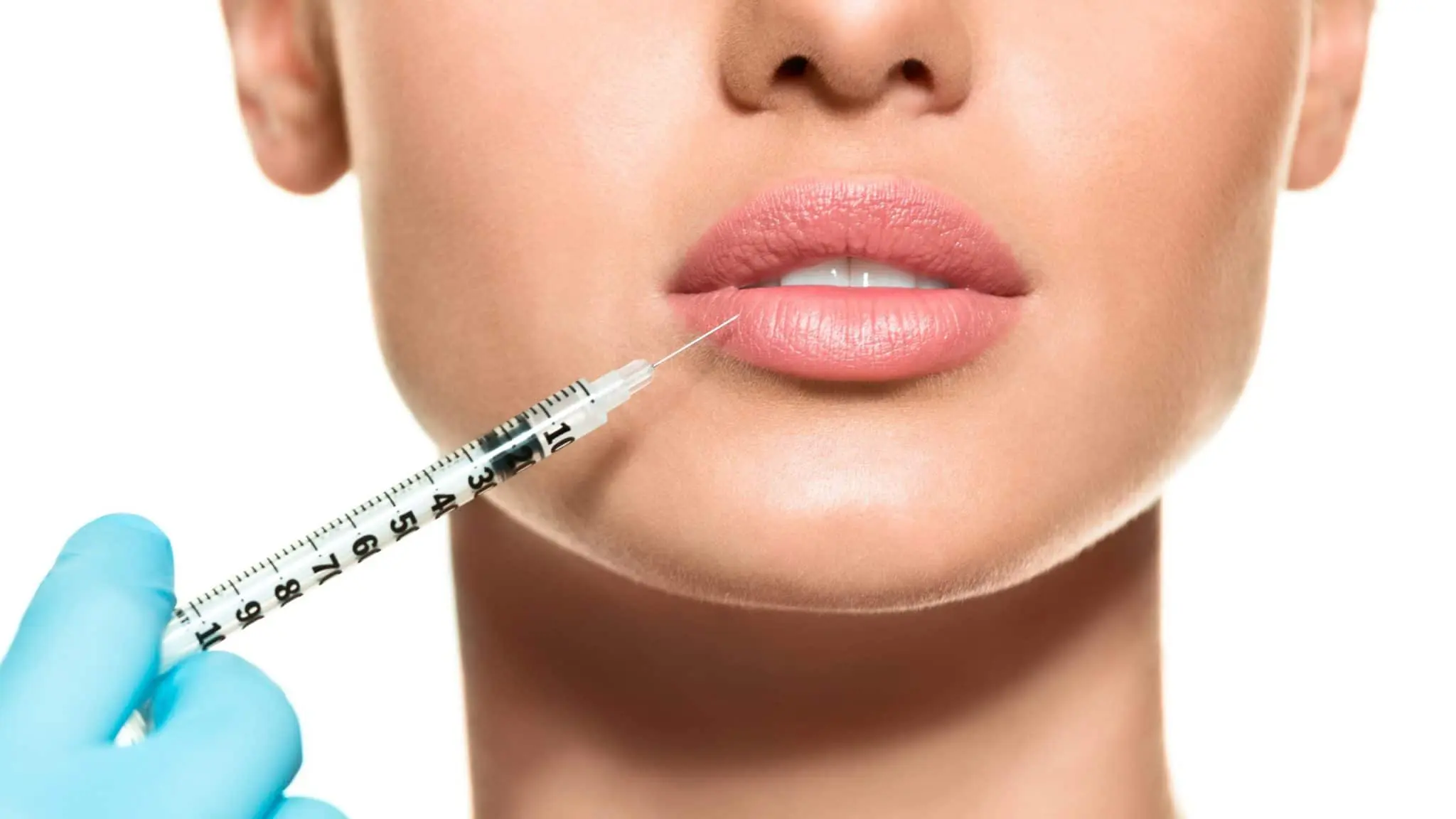 Lady receiving lip filler injection