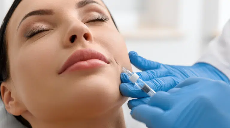 Lady receiving dermal filler treatment