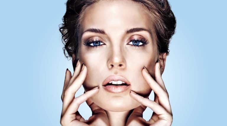Lady holding face